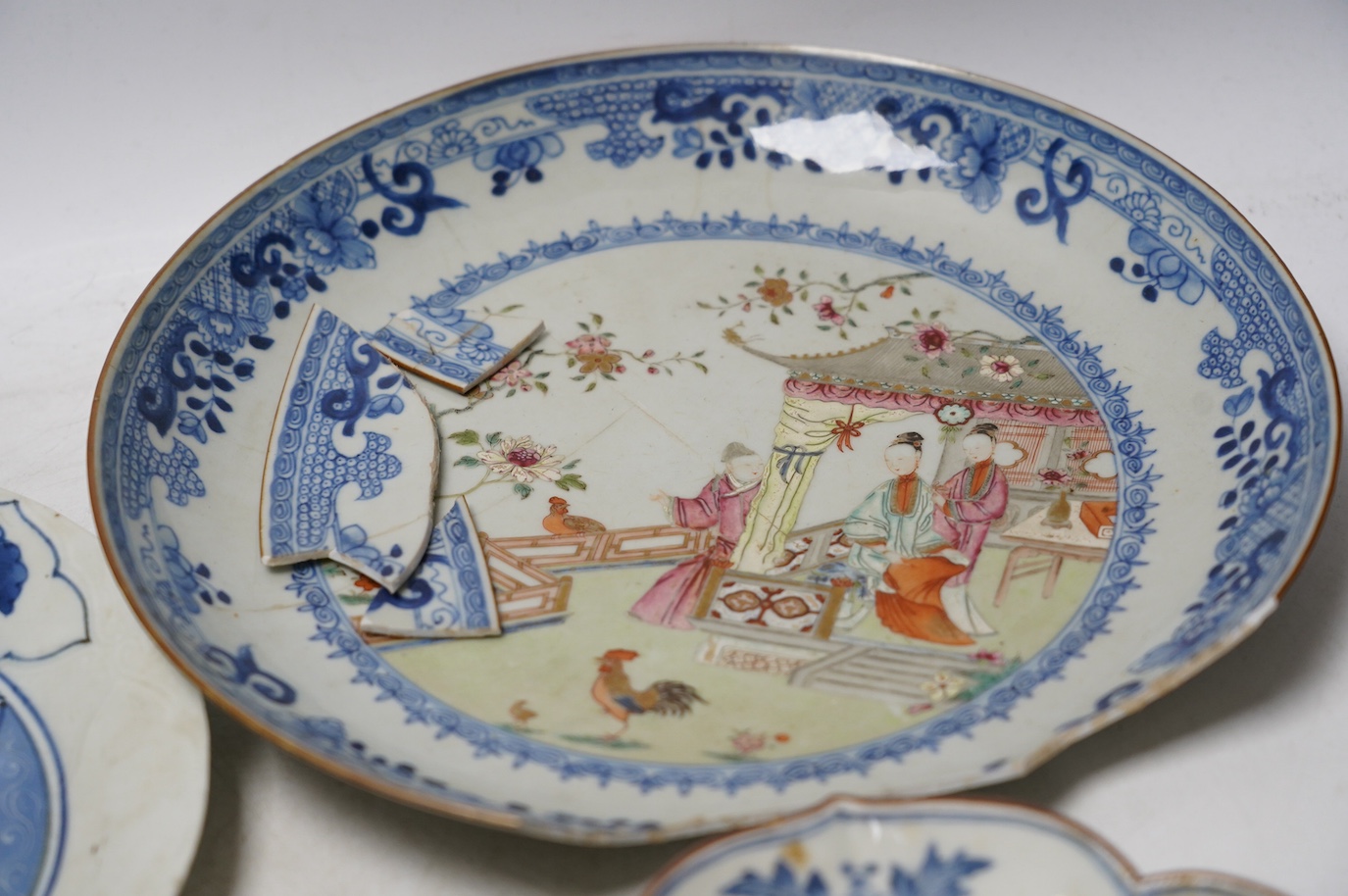 Three Japanese Kakiemon style blue and white dishes and an 18th century Chinese famille rose dish. Condition - varies